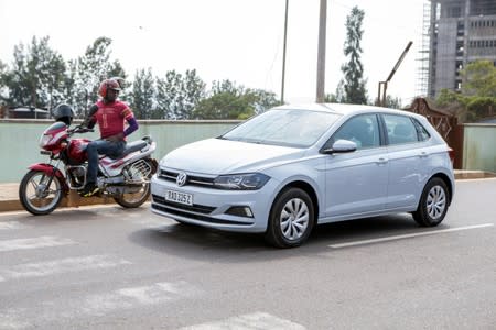 Rwandan Joseline Iradukunda drives her "Move" app-driven ride-hailing service Volkswagen Polo in Kigali