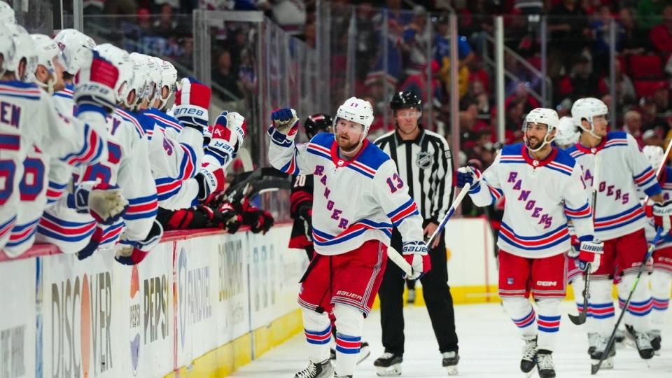 New York Rangers left wing Alexis Lafreniere (13) celebrates his goal against the Carolina Hurricanes during the third period in game three of the second round of the 2024 Stanley Cup Playoffs at PNC Arena.