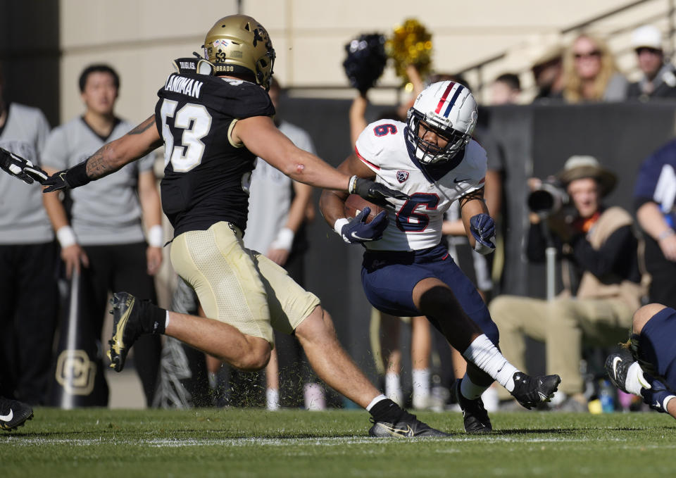 Colorado linebacker Nate Landman, left, comes in to stop Arizona running back Michael Wiley after a short gain in the second half of an NCAA college football game Saturday, Oct. 16, 2021, in Boulder, Colo. (AP Photo/David Zalubowski)