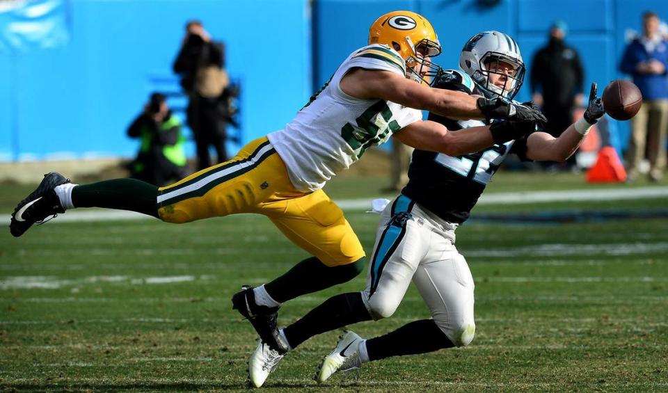 Carolina Panthers running back Christian McCaffrey, right, reaches out in an attempt to catch a pass as Green Bay Packers linebacker Blake Martinez, left, applies defensive pressure during second quarter action on Sunday, December 17, 2017 at Bank of America Stadium in Charlotte, NC.