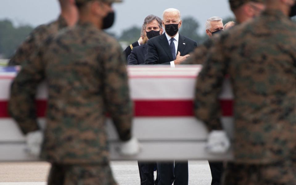 Joe Biden attended the dignified transfer of the remains of fallen service members at Dover Air Force Base in Dover, Delaware, on 29 August 2021 (AFP via Getty Images)