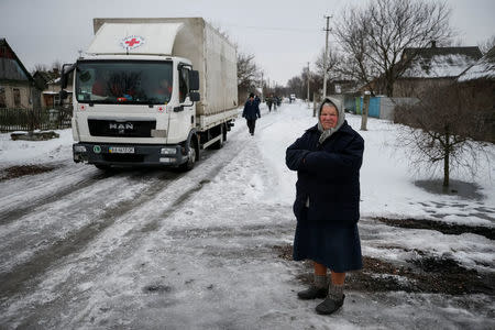 A local resident is seen near buildings that were damaged during fighting between the Ukrainian army and pro-Russian separatists in the government-held industrial town of Avdiyivka, Ukraine, February 6, 2017. REUTERS/Gleb Garanich TPX IMAGES OF THE DAY