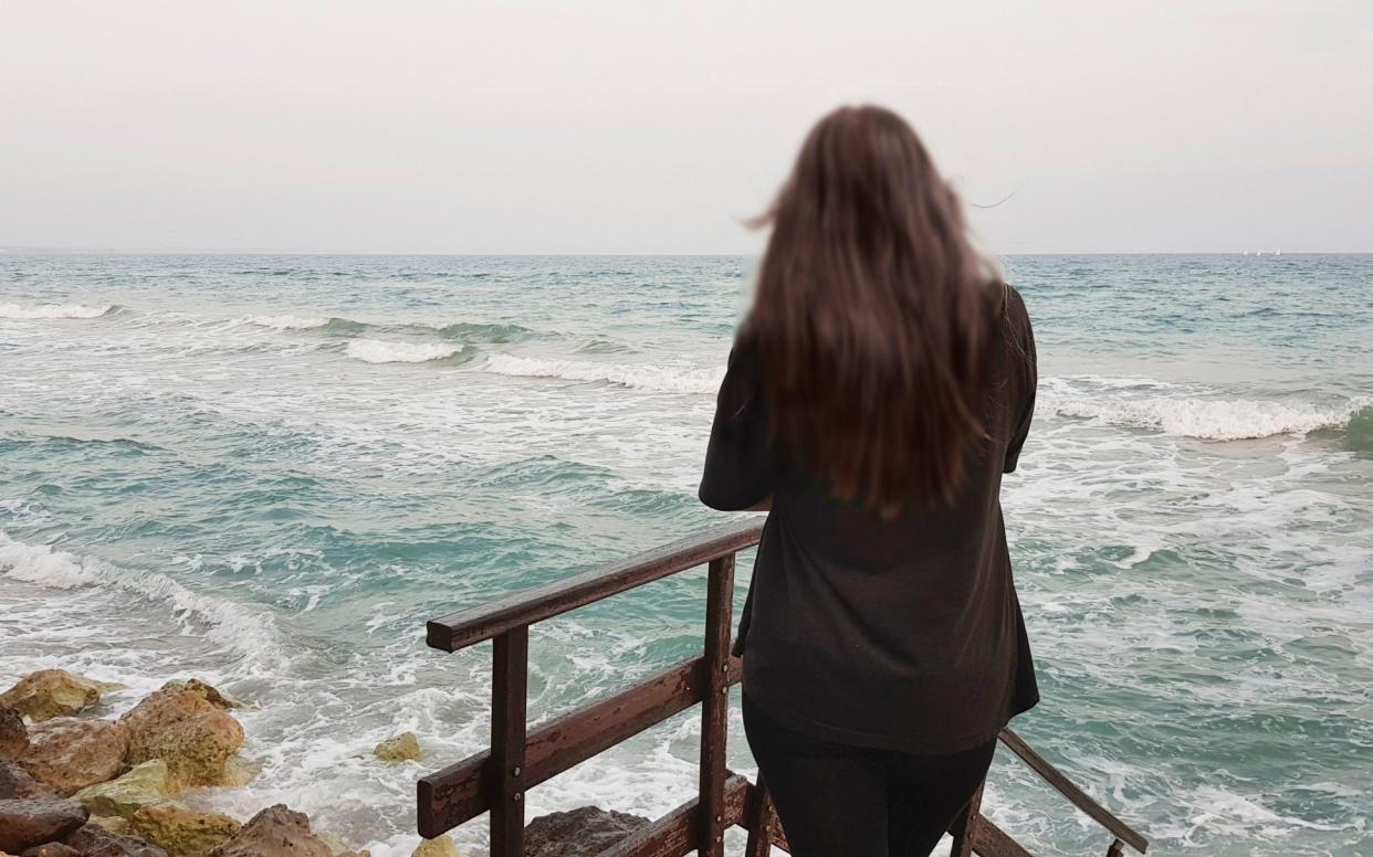 The British teenager looking out to sea near Ayia Napa where the alleged gang rape took place - ITV