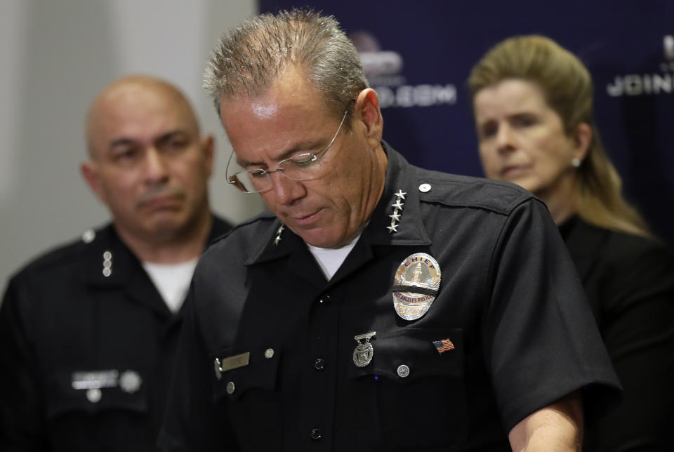 Los Angeles Police Department Chief Michel Moore informs the media on developments on the killing of off-duty police Officer Juan Diaz at LAPD headquarters Tuesday, Aug. 6, 2019, in Los Angeles. Authorities say the fatal shooting of Diaz occurred during a two-hour series of crimes by gang members that included another attempted shooting where the targets were unhurt. Police say the 24-year-old was gunned down after he confronted a trio of gang members spray-painting gang graffiti near a taco stand. (AP Photo/Marcio Jose Sanchez)