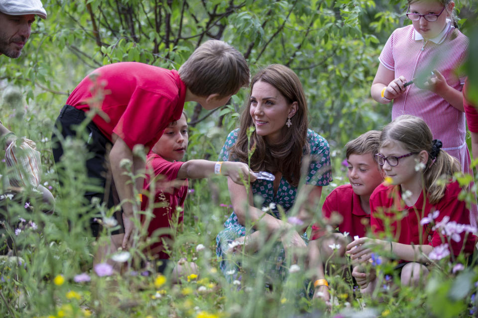 LONDON, ENGLAND - JULY 01: Catherine, Duchess of Cambridge visits the Hampton Court Flower Festival with children from Hampton Hill junior school at Hampton Court Palace on July 1, 2019 in London, England. The Duchess visits her Back to Nature Garden at Hampton Court Palace Garden Festival that she co designed with Andrée Davies and Adam White (Photo by Heathcliff O'Malley - WPA Pool/Getty Images)