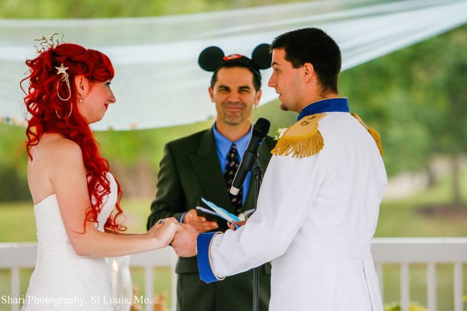 <div class="caption-credit"> Photo by: Shari Photography</div>The pastor wore Mickey Mouse ears and the couple had their first kiss as husband and wife to The Little's Mermaid's "Kiss the Girl."