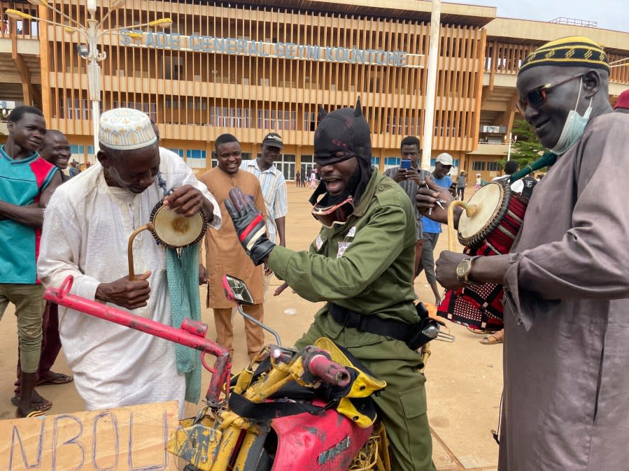 Supporters of Niger’s ruling junta play instruments in Niamey, Niger, Sunday, Aug. 6, 2023. Nigeriens are bracing for a possible military intervention as time’s run out for its new junta leaders to reinstate the country’s ousted president. (AP Photo/Sam Mednick)