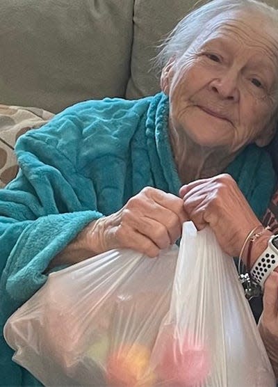 Margaret Woods holds on tight to one of the food deliveries she regularly receives from Pie in the Sky Community Alliance, which is working to end senior hunger in St. Johns County.