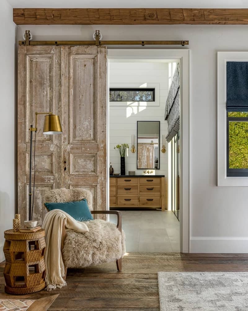 Distressed barn door with view into bedroom