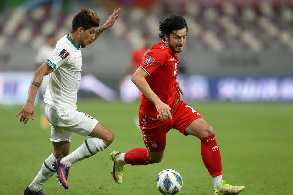 Sardar Azmoun runs with the soccer ball at his feet