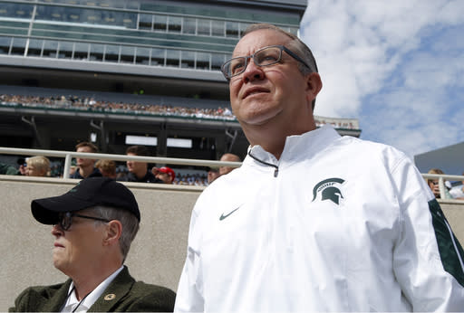 Mark Hollis, right, resigned as Michigan State athletic director just days after MSU president Lou Anna Simon, left, did the same. (AP)