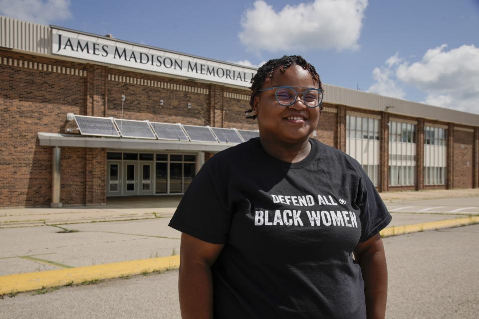 Shyra Adams stands outside James Madison Memorial High School Friday, July 17, 2020,in Madison, Wis. Adams helps lead a parent-driven movement to get police out of schools in Madison, including her high school, James Madison Memorial. (AP Photo/Morry Gash)