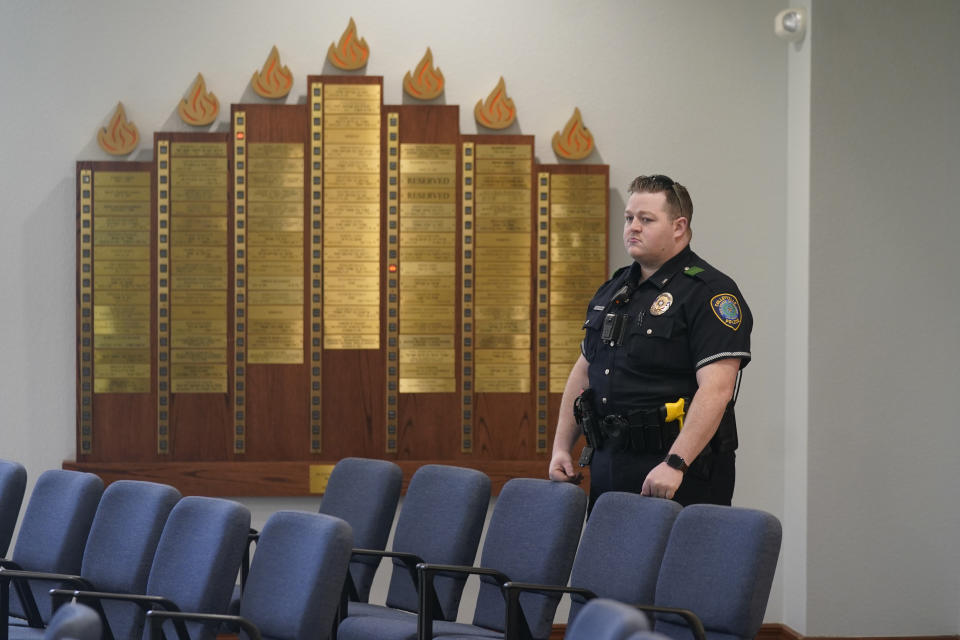 A police officer stands by during a media tour of Congregation Beth Israel in Colleyville, Texas, Thursday, April 7, 2022. Three months after an armed captor took the three men hostage at the synagogue, the house of worship is reopening. (AP Photo/LM Otero)