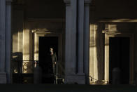 A man stands by the Quirinale presidential palace in Rome, Wednesday, Jan. 27, 2021. Italian Premier Giuseppe Conte resigned after a key coalition ally pulled his party's support over Conte's handling of the coronavirus pandemic, setting the stage for consultations this week to determine if he can form a third government. (AP Photo/Alessandra Tarantino)