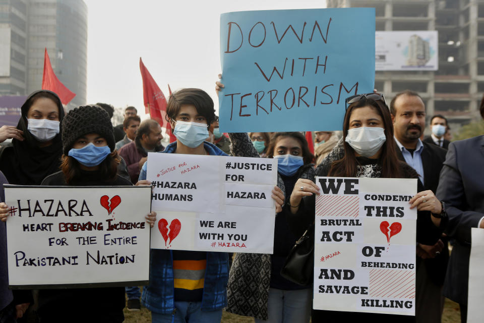 Supporters of a civil society organization hold a demonstration to protest the killing of coal mine workers by gunmen near the Machh coal field, in Lahore, Pakistan, Thursday, Jan. 7, 2021. Pakistan's minority Shiites continued their sit-in for a fifth straight day insisting they will bury their dead only when Prime Minister Imran Khan personally visits them to assure protection. (AP Photo/K.M. Chaudary)