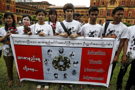 Members of Muslims Youth Network Myanmar pose for photos during an event marking the anniversary of Martyrs' Day at the Ministers' Building, formerly known as the Secretariat Builidng, where General Aung San and eight others were assassinated, in Yangon July 19, 2015. REUTERS/Soe Zeya Tun
