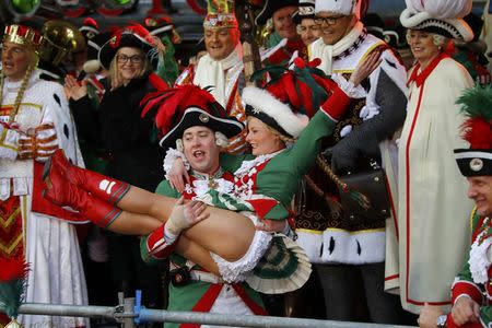 Carnival revellers celebrate during "Weiberfastnacht" (Women's Carnival) in Cologne, Germany February 23, 2017, marking the start of a week of street festivals with the highlight "Rosenmontag", Rose Monday processions. REUTERS/Wolfgang Rattay