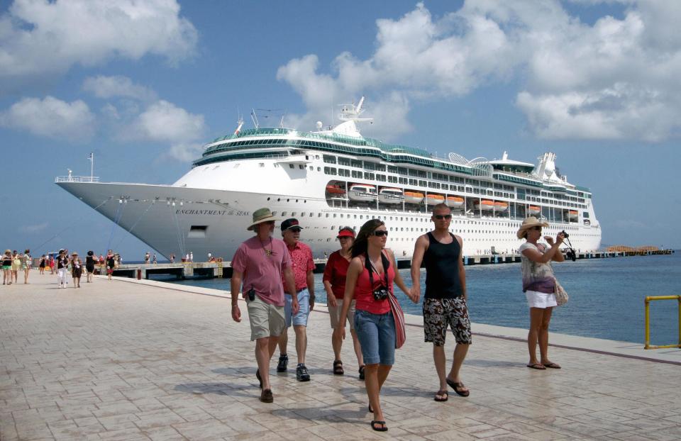 Tourists walk at Cozumel's port in Mexico.