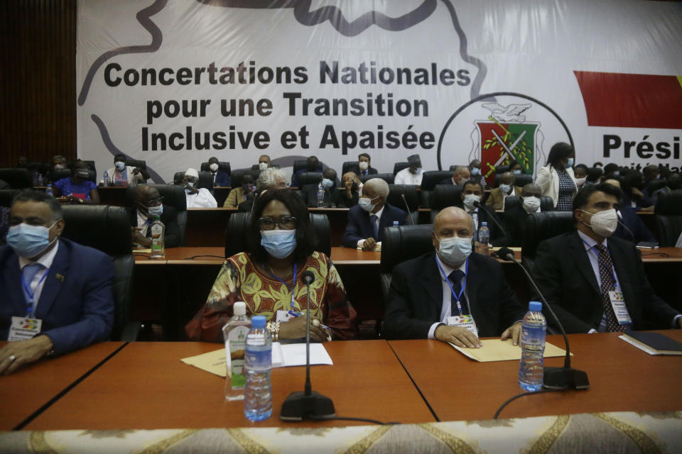 Ambassadors and foreign representations, wait for meeting with Military junta led by Col. Mamady Doumbouya, at the people's palace in Conakry, Guinea Wednesday, Sept. 15, 2021. Guinea's junta is expected to face more pressure to set a timeframe for new elections Tuesday as the military rulers open a four-day series of meetings about the West African nation's future following the president's overthrow in a coup just over a week ago. (AP Photo/Sunday Alamba)