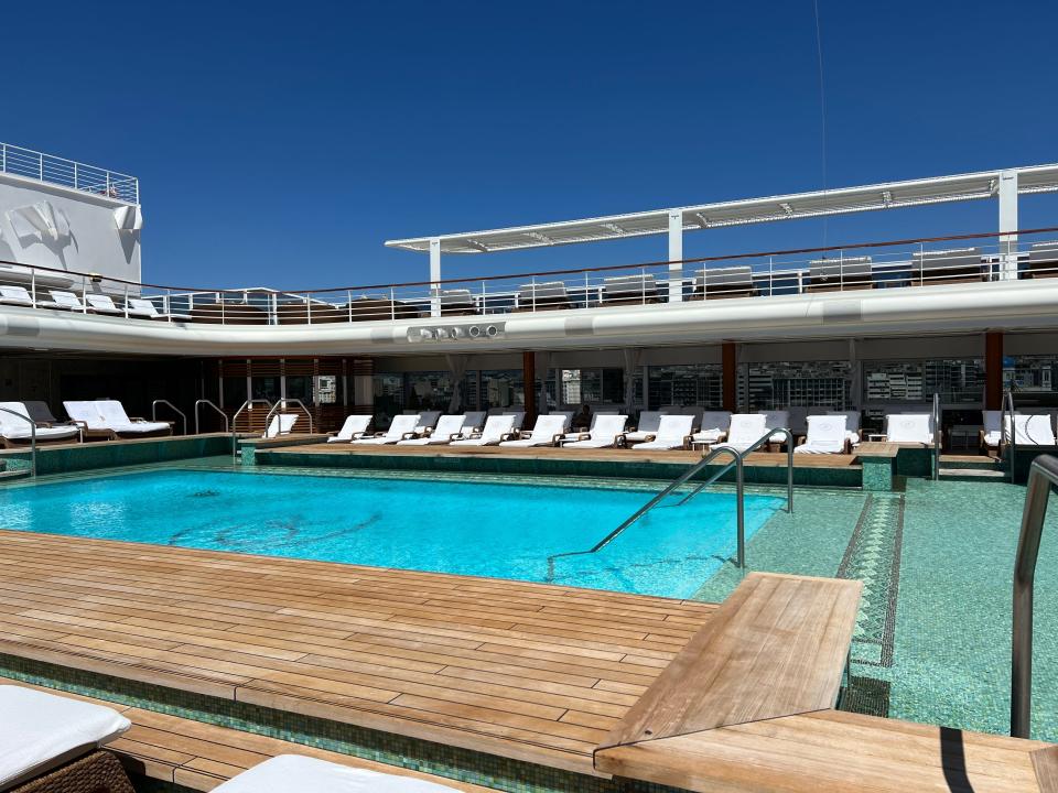 luxury pool on a cruise ship deck of a regent seven seas explorer with lounge chairs