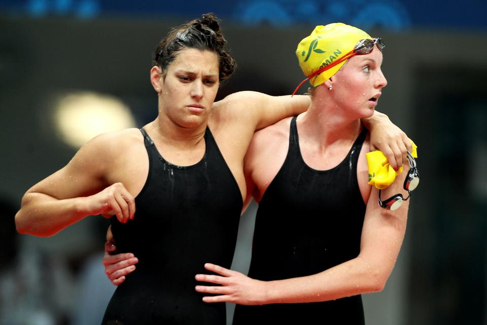 Blair Evans, left, is consoled by Melissa Gorman after competing in the Women's 800m Freestyle Final at the Dr. S.P. Mukherjee Aquatics Complex during day four of the Delhi 2010 Commonwealth Games on October 7, 2010 in Delhi, India. (Photo by Ian Walton/Getty Images)