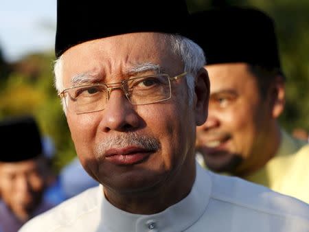 Malaysia's Prime Minister Najib Razak arrives for a news conference at a mosque outside Kuala Lumpur, Malaysia, in this July 5, 2015 file photo.REUTERS/Olivia Harris/Files