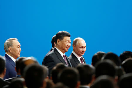 Chinese President Xi Jinping and Russian President Vladimir Putin arrive for the opening ceremony for the second Belt and Road Forum in Beijing, China April 26, 2019. REUTERS/Florence Lo