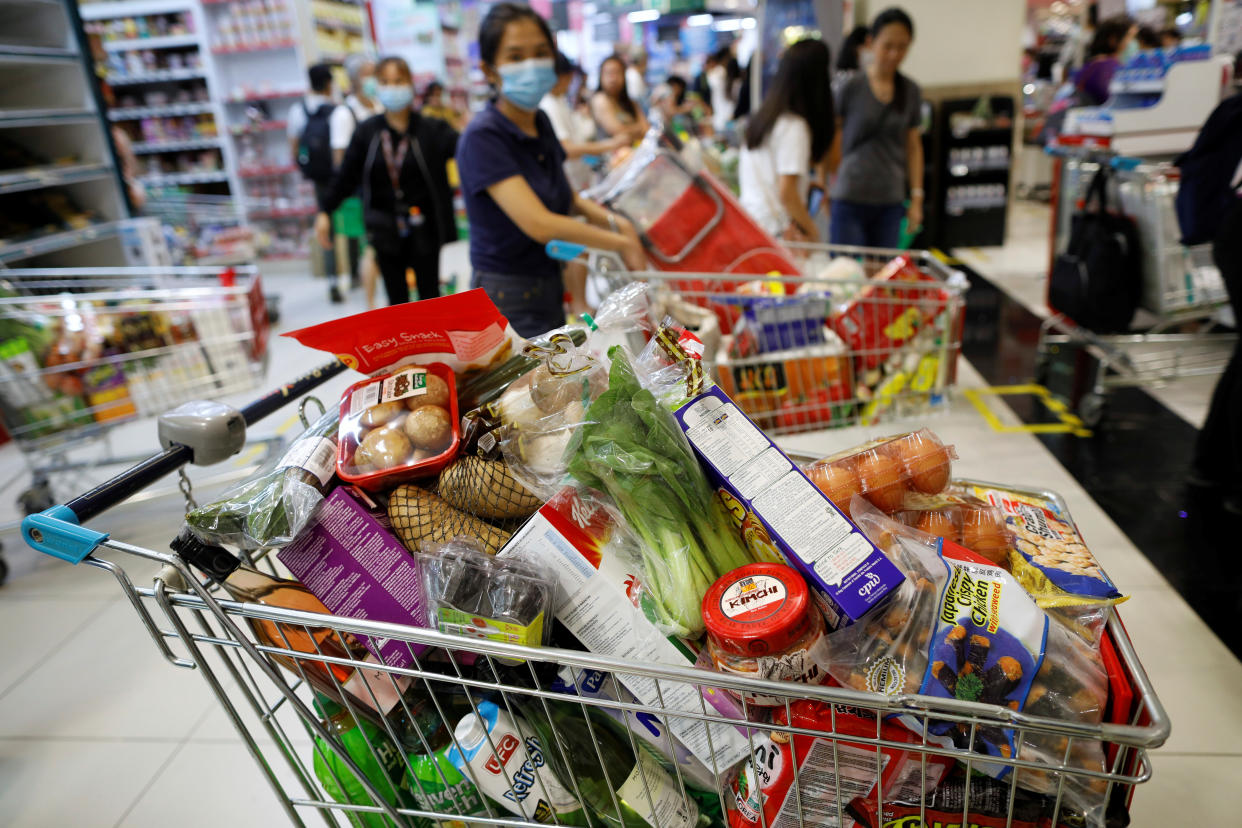 A shopping cart is filled with groceries in a supermarket during the outbreak here on 3 April, 2020. (PHOTO: Reuters)