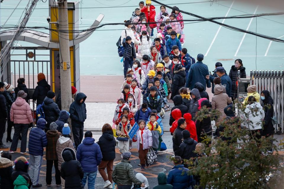 Students are dismissed from a school in Beijing (EPA)