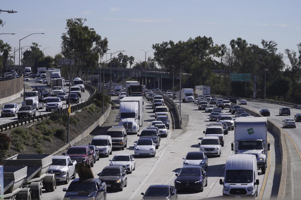 Motorists wait on Interstate 5 south bound in heavy traffic after a fire closed Interstate 10, Tuesday, Nov. 14, 2023, in Los Angeles. California Gov. Gavin Newsom says a stretch of Interstate 10 in Los Angeles that was burned in an act of arson does not need to be demolished, and that repairs will take an estimated three to five weeks. Newsom announced the finding Tuesday, based on analysis of core samples taken from the freeway, a vital artery used by 300,000 vehicles daily. (AP Photo/Damian Dovarganes)