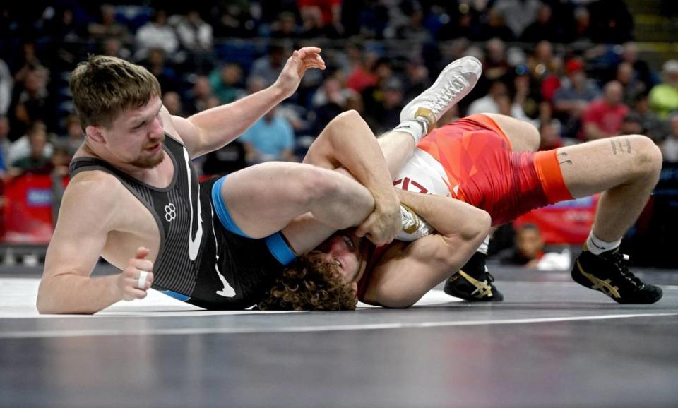 Mitchell Mesenbrink rolls Jarrett Jacques in the third place bout at the 74 kg weight class during the U.S. Olympic Team Trials at the Bryce Jordan Center on Saturday, April 20, 2024. Mesenbrink won by tech. superiority, 10-0.