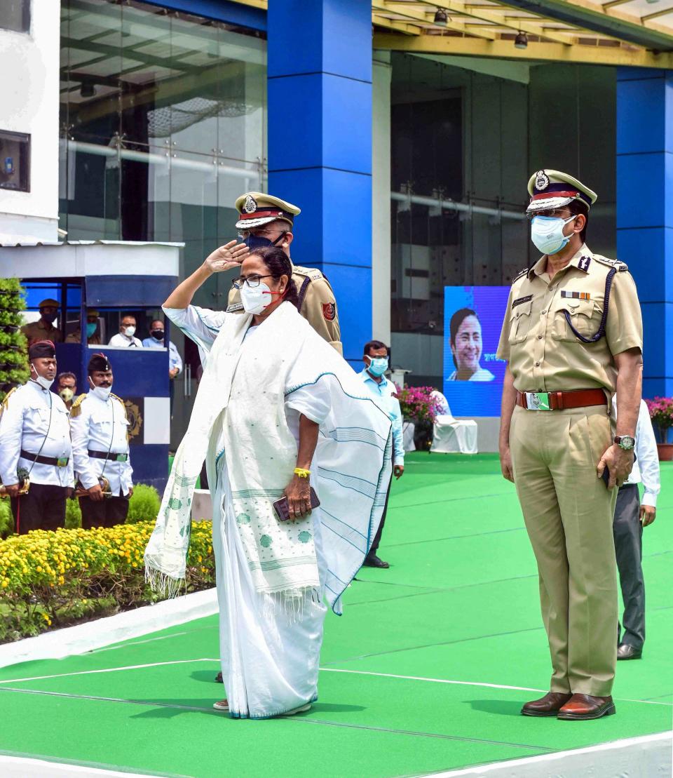 West Bengal Chief Minister Mamata Banerjee inspects a guard of honour on arrival at her office after her swearing-in ceremony at Nabanna in Kolkata on Wednesday.