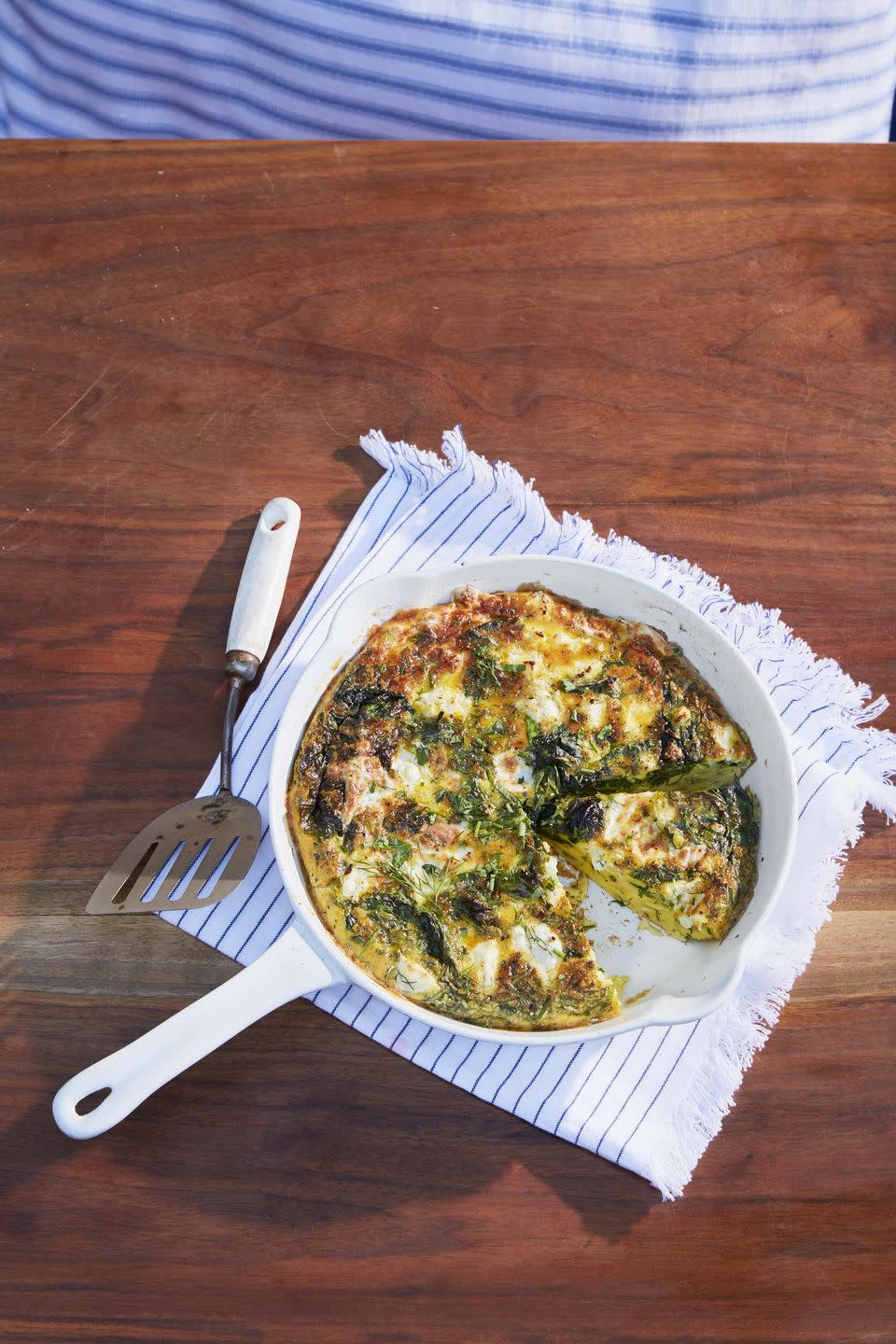 <p>Think of this cheesy, eggy delight as your go-to breakfast-for-dinner option.</p><p><strong><a href="https://www.countryliving.com/food-drinks/a32353869/cheesy-frittata-with-spring-greens-and-shallots/" rel="nofollow noopener" target="_blank" data-ylk="slk:Get the recipe;elm:context_link;itc:0;sec:content-canvas" class="link ">Get the recipe</a>.</strong></p><p><a class="link " href="https://www.amazon.com/Crock-111976-01-Artisan-Enameled-Skillet/dp/B072QGDB2F/?tag=syn-yahoo-20&ascsubtag=%5Bartid%7C10063.g.35055779%5Bsrc%7Cyahoo-us" rel="nofollow noopener" target="_blank" data-ylk="slk:SHOP ENAMEL SKILLETS;elm:context_link;itc:0;sec:content-canvas">SHOP ENAMEL SKILLETS</a></p>