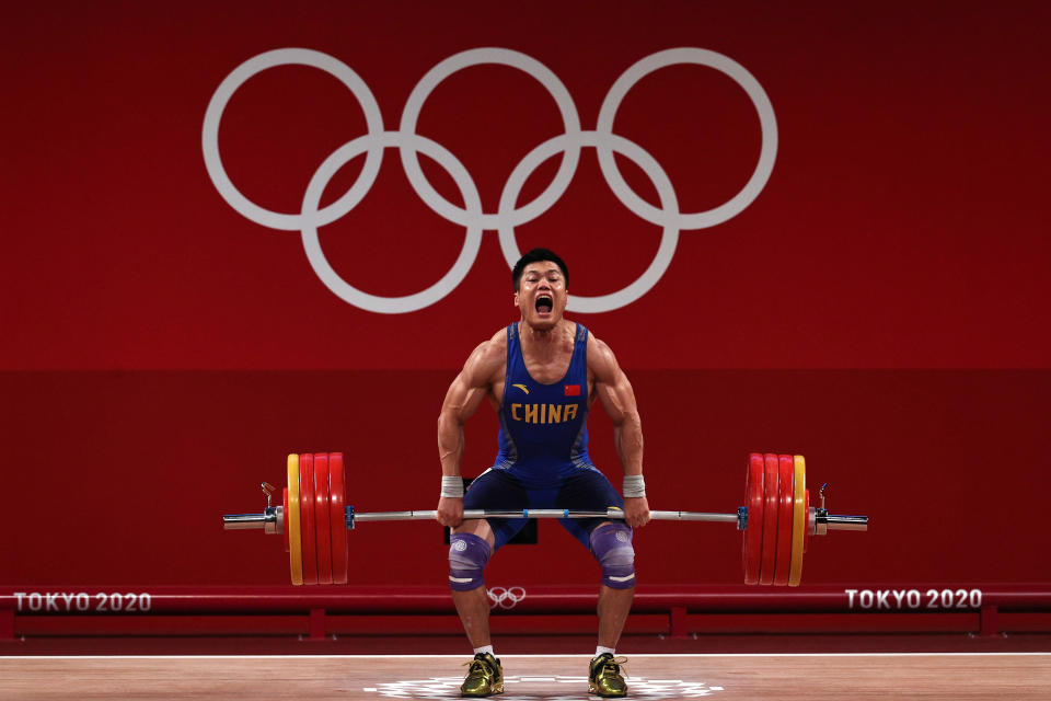 <p>TOKYO, JAPAN - JULY 31: Xiaojun Lyu of Team China competes during the Weightlifting - Men's 81kg Group A on day eight of the Tokyo 2020 Olympic Games at Tokyo International Forum on July 31, 2021 in Tokyo, Japan. (Photo by Chris Graythen/Getty Images)</p> 