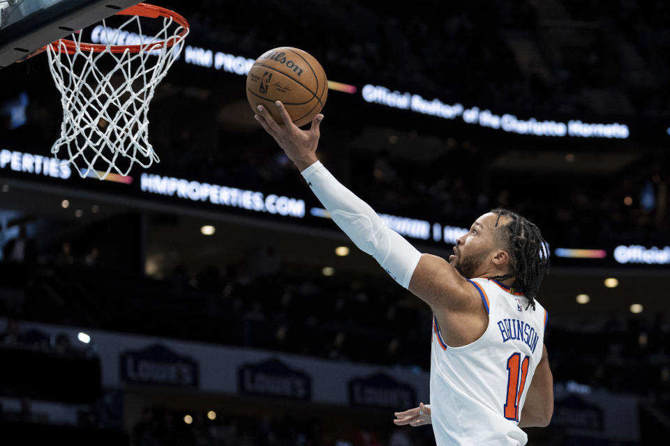 New York Knicks guard Jalen Brunson drives to the basket during the second half of an NBA basketball game against the Charlotte Hornets, Monday, Jan. 29, 2024, in Charlotte, N.C. (AP Photo/Jacob Kupferman)