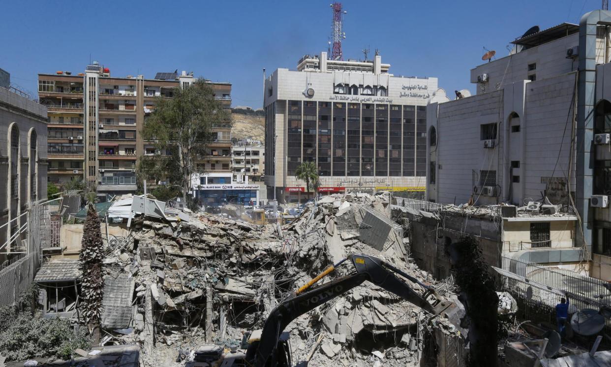 <span>The rubble of a building annexed to the Iranian embassy a day after an airstrike in Damascus, Syria.</span><span>Photograph: Louai Beshara/AFP/Getty Images</span>