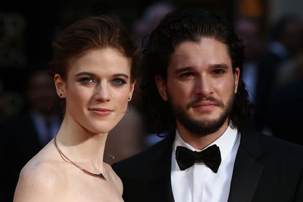 Rose Leslie and Kit Harington pose on the red carpet upon arrival to attend the 2016 Laurence Olivier Awards in London on April 3, 2016.