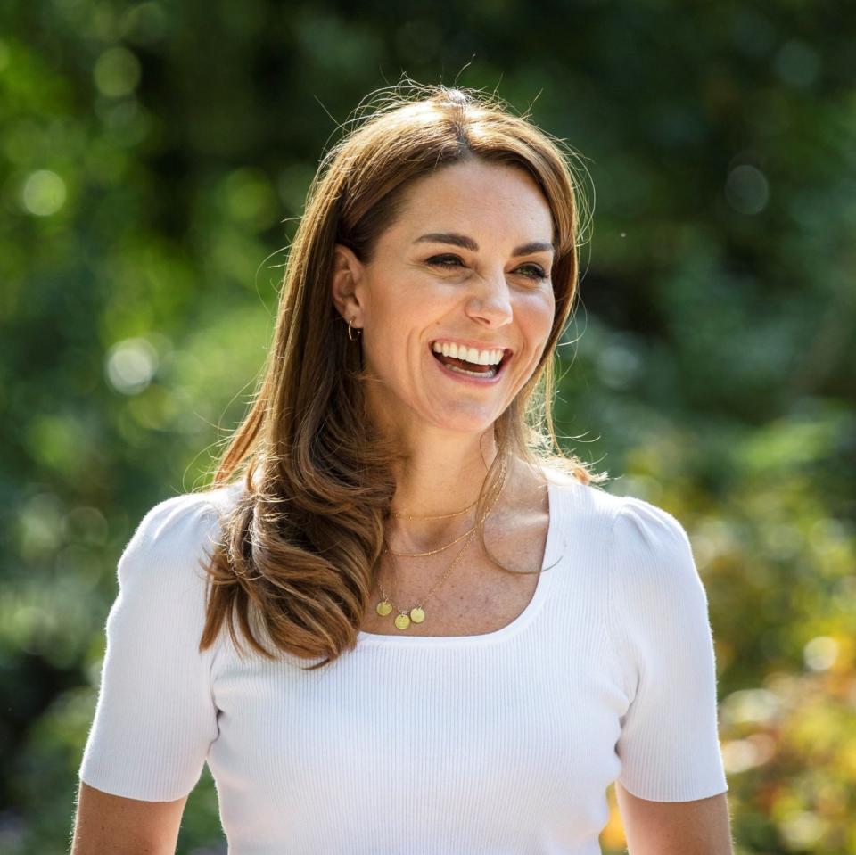 Kate wearing her G, C, L necklace in September - AFP