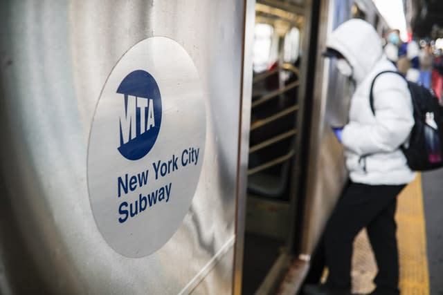 Passengers use the New York City subway system