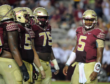 Jameis Winston (5) calls a play in the huddle during FSU's win over Citadel. (USA Today)