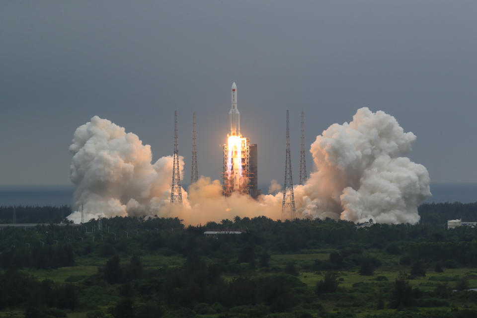 In this photo released by China's Xinhua News Agency, a Long March 5B rocket carrying a module for a Chinese space station lifts off from the Wenchang Spacecraft Launch Site in Wenchang in southern China's Hainan Province, Thursday, April 29, 2021. China has launched the core module on Thursday for its first permanent space station that will host astronauts long-term. (Ju Zhenhua/Xinhua via AP)