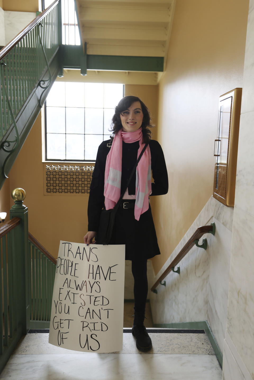 Adriel Lepp, from Charleston, holds a sign during a protest against HB 2007, which would ban health care for children at the state capitol in Charleston, W.Va., on March 9, 2023. "I think it's very important to protect myself and people like me," Lepp said. "We are starting to see a slip into dangerous territories in the country." (AP Photo/Chris Jackson)