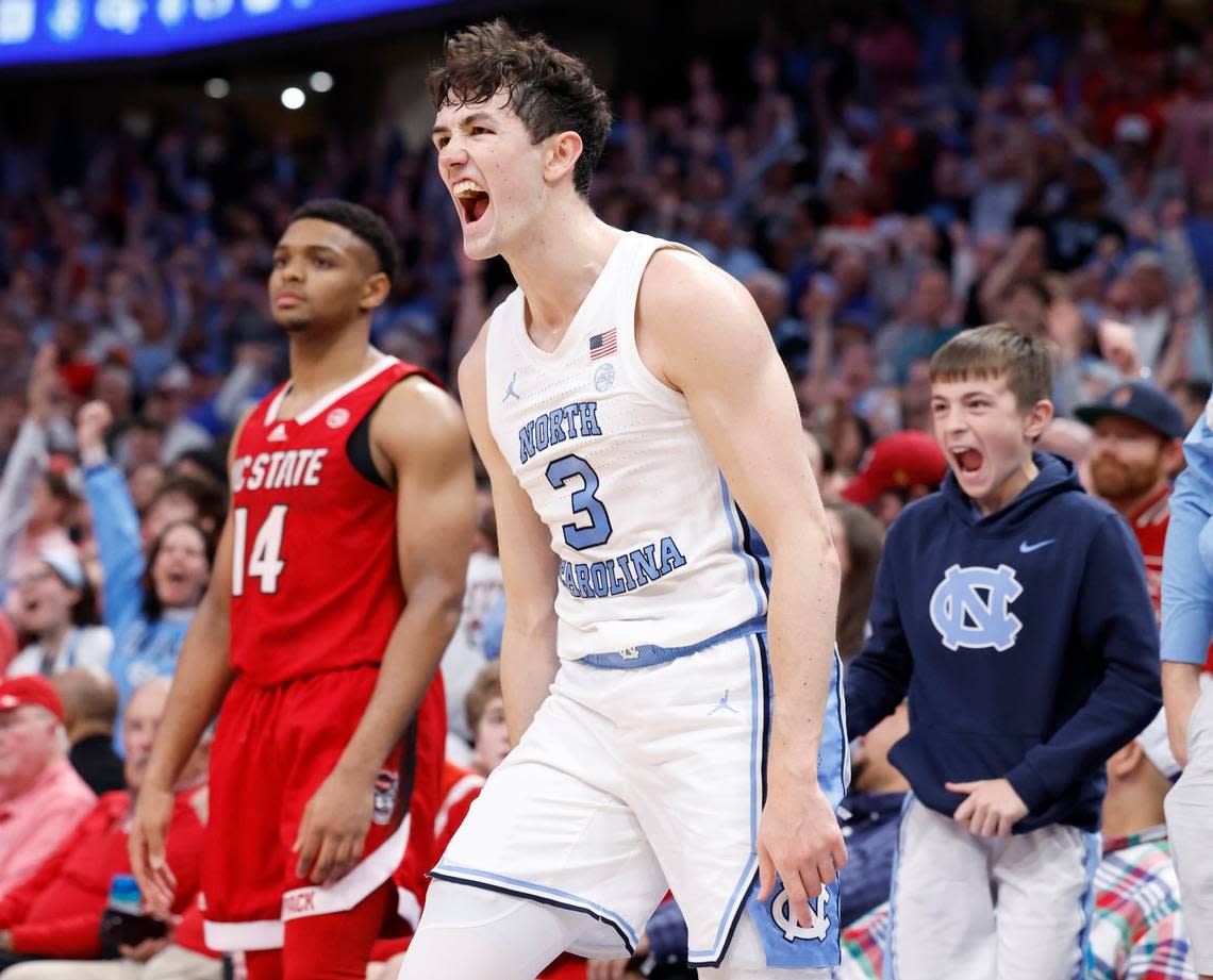 North Carolina’s Cormac Ryan (3) celebrates making a three-pointer as time run out in the first half of N.C. State’s game against UNC in the championship game of the 2024 ACC Men’s Basketball Tournament at Capital One Arena in Washington, D.C., Saturday, March 16, 2024.