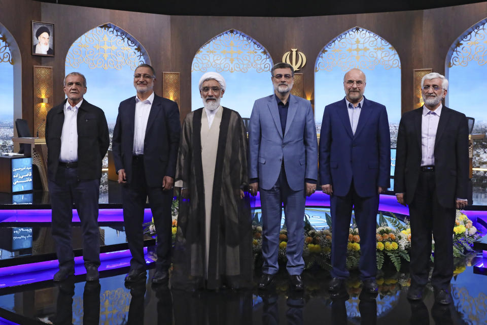 FILE - In this picture made available by Iranian state-run TV, IRIB, presidential candidates for June 28, election from left, Masoud Pezeshkian, Alireza Zakani, Mostafa Pourmohammadi, Amirhossein Ghazizadeh Hashemi, Mohammad Bagher Qalibaf, and Saeed Jalili pose for a photo after the conclusion of their debate at the TV studio in Tehran, Iran, June 25, 2024. Even in a busy year of elections, the next few days stand out. Voters go to the polls over the next week in fledgling democracies like Mauritania and Mongolia, in the Islamic Republic of Iran and in the stalwart democracies of Britain and France. (Morteza Fakhri Nezhad/IRIB via AP, File)