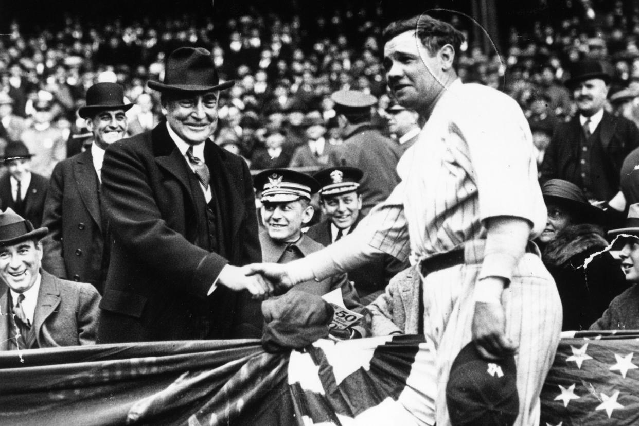  babe ruth (george herman ruth, 1895 - 1948) shakes hands with the 29th president of the usa, warren hardin