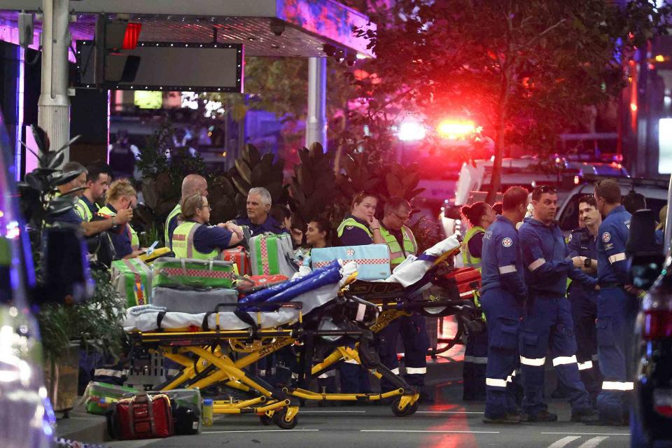 <p>DAVID GRAY/AFP via Getty </p> Paramedics respond to stabbing attack at Westfield Bondi Junction shopping mall in Sydney, Australia, on April 13.