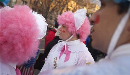 Clowns prepare before the 87th Macy's Thanksgiving day parade in New York November 28, 2013. REUTERS/Carlo Allegri