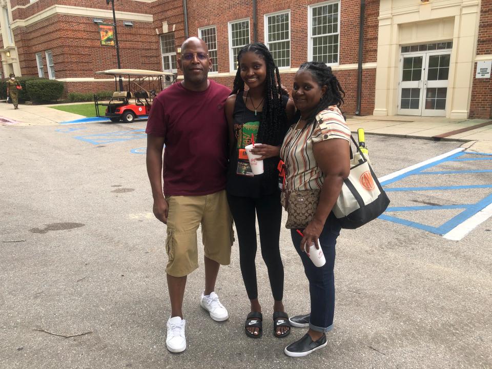 Incoming freshmen Kirsten Donley (middle) accompany her parents Alex (left) and Twana Donley (right) as they attend parent orientation at Florida A&M University's Lee Hall on July 21, 2022.