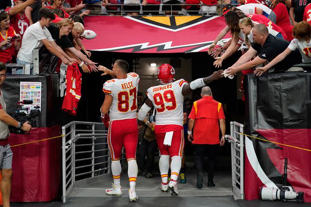 <p>AP Photo/Matt York</p> Travis Kelce and Khalen Saunders leave a 2022 game in Glendale, Arizona