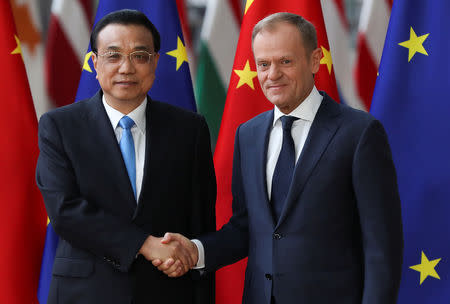 European Council President Donald Tusk shake hands with Chinese Premier Li Keqiang ahead of a EU-China summit in Brussels, Belgium April 9, 2019. REUTERS/Yves Herman